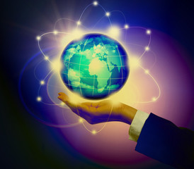 Man holding a glowing earth globe in his hands