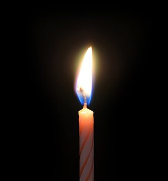 Burning candles on black background