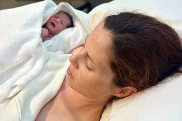 Fototapeta na wymiar Pregnancy - pregnant woman and newborn
