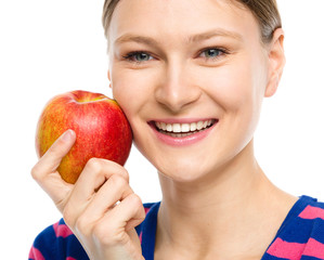 Young happy girl with apple