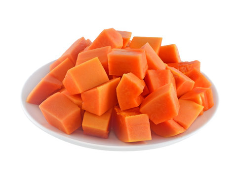 Papaya fruit in dish on white background.