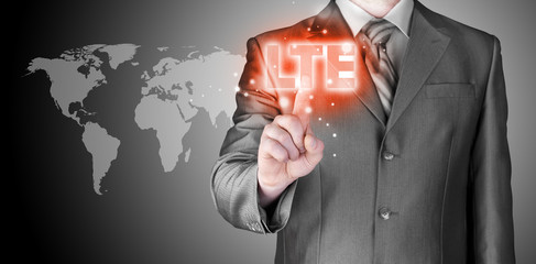 businessman is pushing his finger on lte button