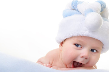 christmas cute baby boy lying on blue soft plaid like on snowdri