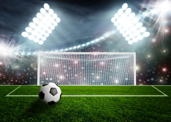Soccer ball on green stadium arena