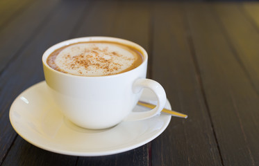 coffee cup on wood black table
