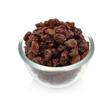 raisins in a bowl isolated on white background