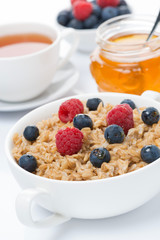 breakfast - oat porridge with fresh berries and honey, black tea