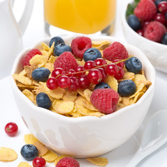 cornflakes with berries, milk and orange juice