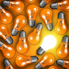 Idea concept with row of light bulbs and glowing bulb