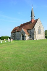 Fototapeta na wymiar English church on green lawn