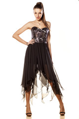 Naklejka premium attractive girl posing in long evening dress