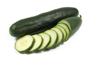 Fresh cucumber and slices isolated on a white background