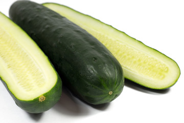 Fresh cucumber and slices isolated on a white background