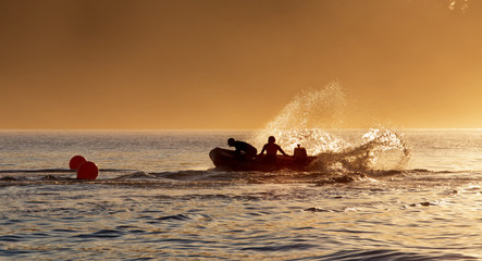 Members of the surf lifesaving club practice their boat drills 
