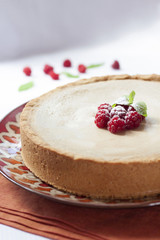 Coffee and cream cake with raspberries