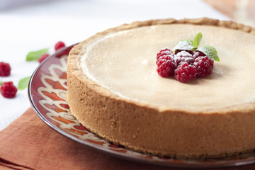 Coffee and cream cake with raspberries