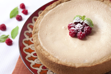 Coffee and cream cake with raspberries