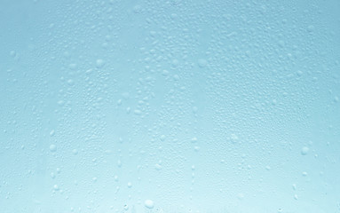 Fototapeta premium Blue glass water drop background