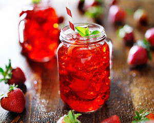 vivid red strawberry cocktail in a jar