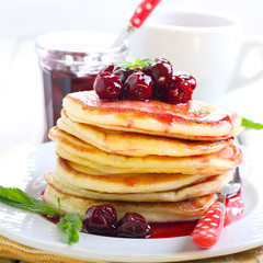Pancakes with cherry sauce