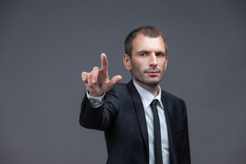 Portrait of business man pointing hand gestures, isolated