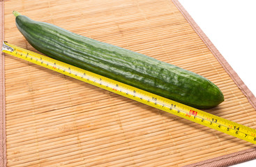 Big yellow centimeter and big green cucumber.