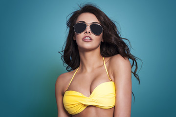 Sexy woman wearing fashion glasses in summer time