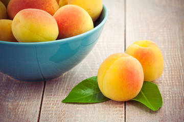 fresh peaches on wooden table