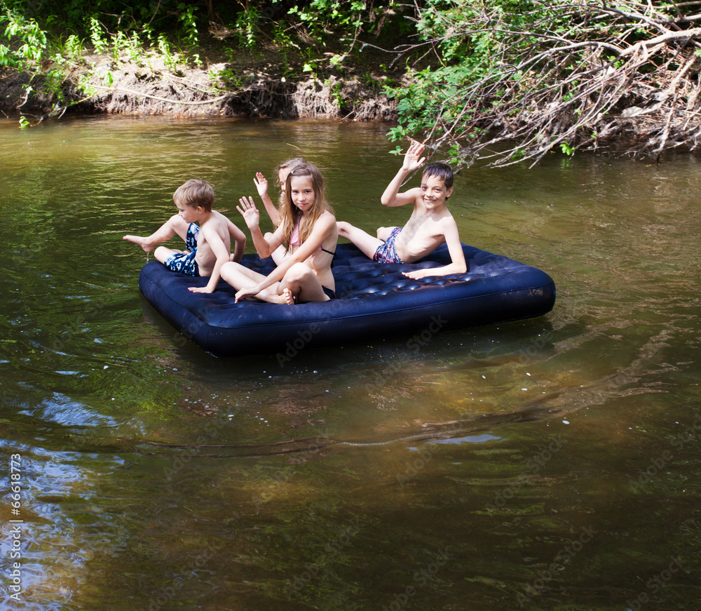 Poster Children floating on the river