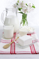 Tasty dairy products on wooden table