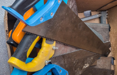 different saws in the box in a workshop