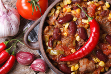hot chili con carne in a pot macro top view