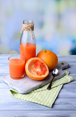 Ripe grapefruits and fresh juice