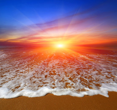 Fototapeta sunset over ocean beach