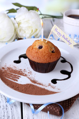 Blueberry muffin with chocolate sauce