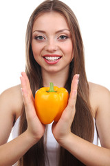 Beautiful girl with yellow pepper, isolated on white