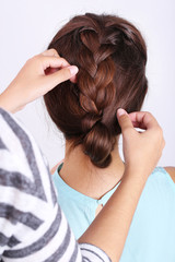 Fototapeta premium Creating hairstyles hairdresser close-up