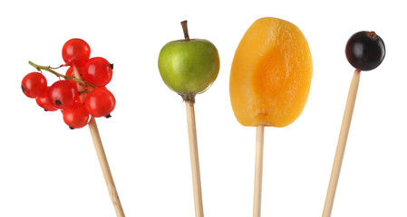 Fresh fruit skewers isolated on white