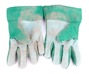 Dirty used fabric gloves isolated on white