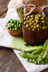 Fresh  and canned peas in bowl and glass jar