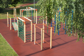 Children Playground outdoors in summer park after rain