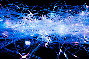 abstract illuminated blue fiber optics wires