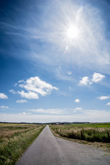 cloudscape above country road