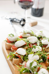 Tomato, mozzarella and arugula sandwich