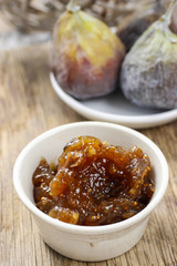 Bowl of fig jam and raw figs