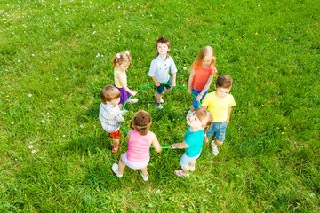 Kids holding hoop, view from top © Sergey Novikov