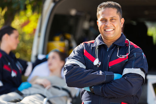 paramedic in front of patient and colleague