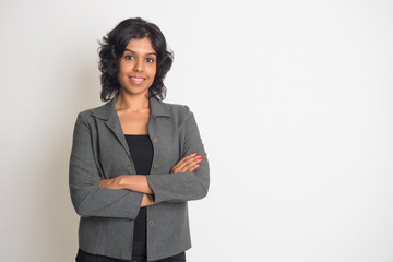 indian business woman smiling with plain background