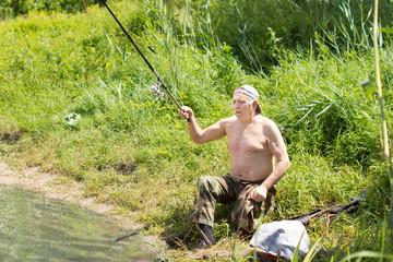 Disabled man casting his fishing rod
