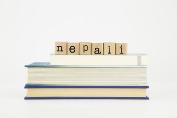 nepali language word on wood stamps and books